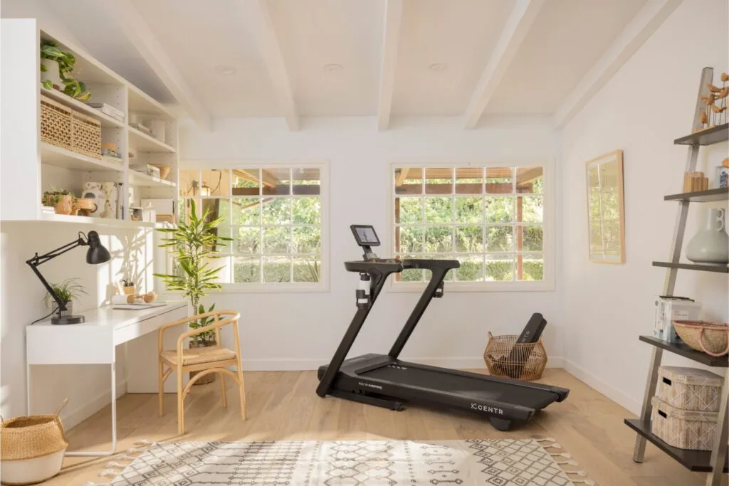 one of Centr's new treadmills, shown in a small space