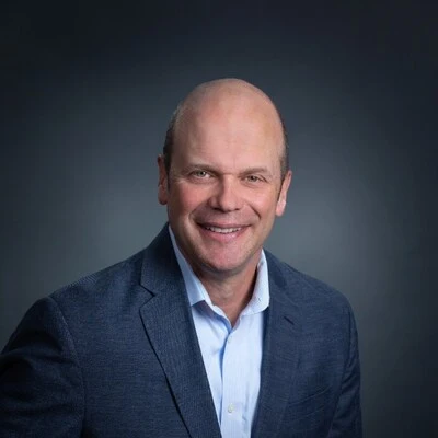 a smiling image of new Planet Fitness CFO Jay Stasz