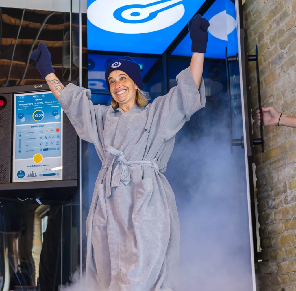 Woman stepping out of cryotherapy machine