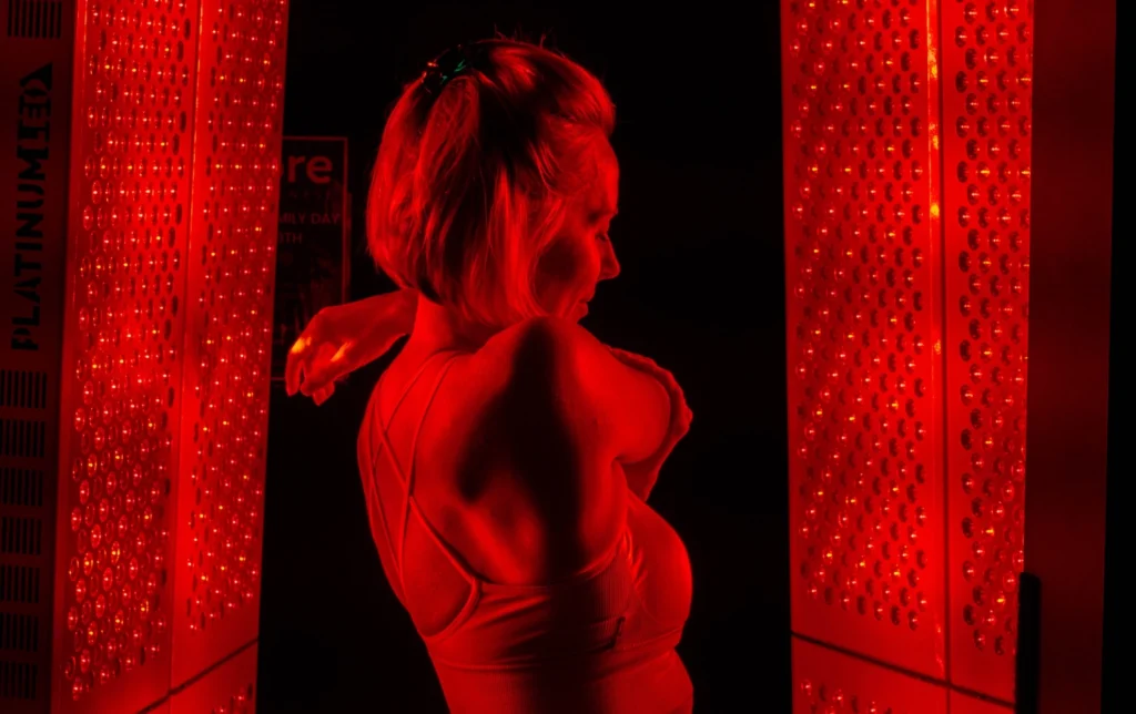 woman in red light machine